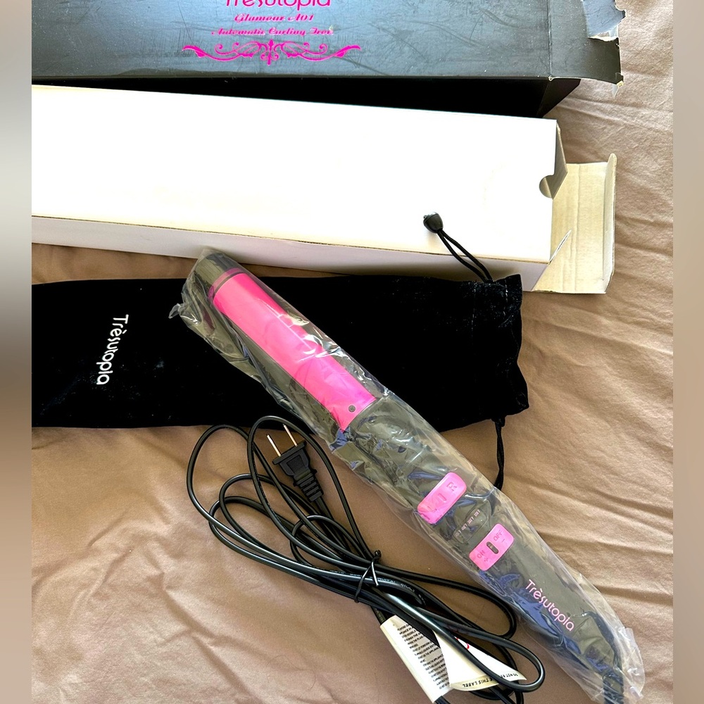 Brand new Tresutopia automatic curling iron.